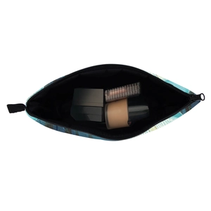 Teal mushroom pattern cosmetic bag showing interior space with makeup accessories