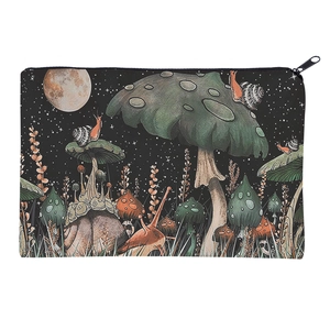 Detailed view of the mushroom print makeup bag featuring a metallic zipper and starry night art
