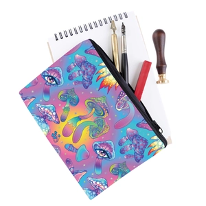 Detail view of the colorful mushroom print organizer bag filled with stationery items