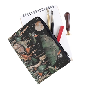 Detail shot of square mushroom print makeup bag with magical forest snail pattern