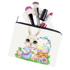 Portable white rabbit print cosmetic bag with easter patterns and makeup brushes