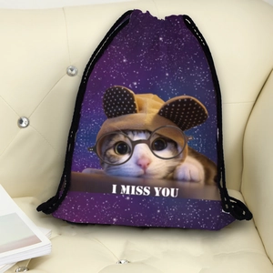 Purple starry drawstring backpack with a cute cat print on a cream sofa background