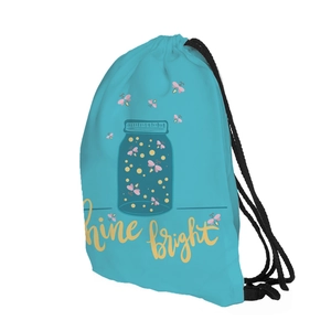 Macro detail of firefly printed drawstring bag with Shine Bright lettering on blue fabric