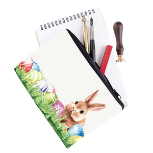 Detailed macro view of the bunny print canvas pouch with black zipper and stationery