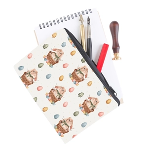 Detail of bunny and Easter egg print on canvas makeup bag with a metal zipper closure