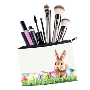 Macro view of white bunny printed makeup bag showing spacious interior with cosmetic brushes