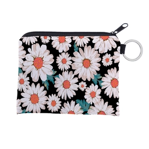 Detail of floral daisy print on water-resistant canvas coin purse with metal keychain