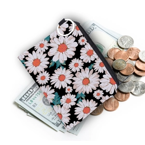 Waterproof daisy print coin purse with silver keychain ring and loose change props