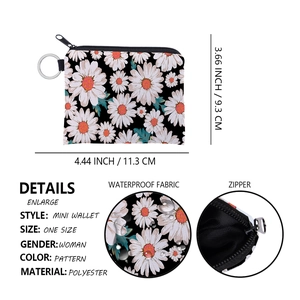 Detail view of water-resistant floral daisy mini wallet with zipper and key ring