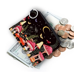 Waterproof colorful mushroom print coin purse with zipper and scattered coins background
