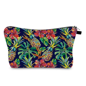 Close-up of waterproof pineapple print travel makeup bag with tropical floral pattern