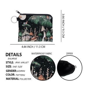 Detail view of colorful mushroom print mini wallet showing waterproof fabric and metal keyring