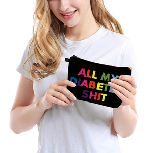 Portable travel pouch with colorful text print and top zipper for diabetes supplies