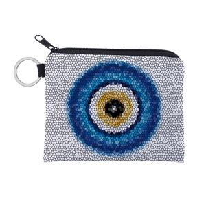 Detail of fabric coin purse with blue evil eye pattern and metal keychain zipper