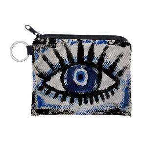 Close-up of canvas Evil Eye coin purse showing durable texture and metal keyring