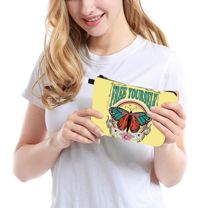 Portable butterfly print cosmetic bag with Free Yourself slogan and black zipper closure