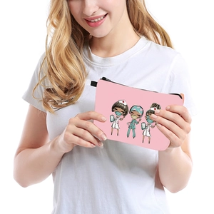 Pink portable makeup bag with cute nurse cartoon prints held by a model on white background