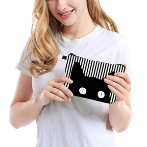 Portable makeup bag with black and white stripes and cute cat face print for travel