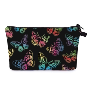 Close-up of durable black zipper and vibrant butterfly print on travel makeup bag