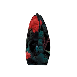 Detail view of tropical plant print makeup bag with smooth zipper and triangular side profile