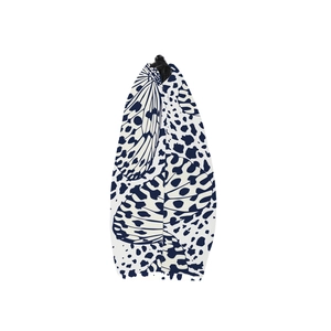 Close-up detail of butterfly pattern fabric and black zipper on travel makeup bag
