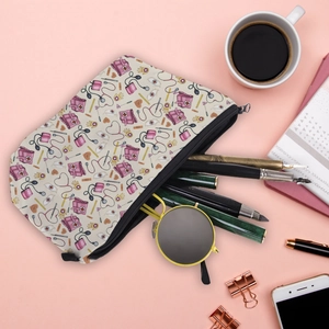 Cute nurse print canvas makeup bag and travel toiletries organizer on a pink desk