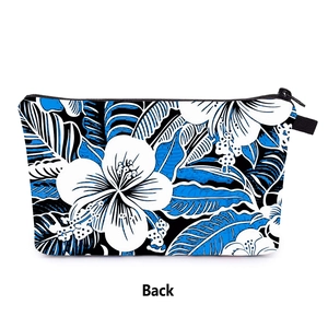 Detailed back view of a black floral makeup bag with blue and white hibiscus flower prints