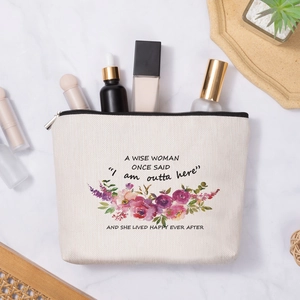 Linen style floral makeup bag with inspirational quote on elegant marble surface