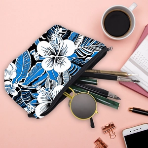 Tropical floral print cosmetic bag with white hibiscus and blue leaves on black fabric