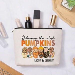 Linen pouch with Delivering the cutest Pumpkins print on marble with skincare accessories