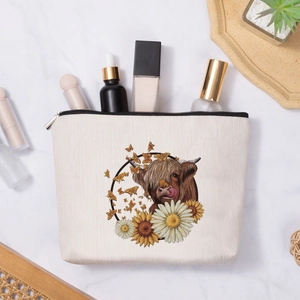 Linen pouch with highland cow and sunflowers print for cosmetics and travel organization