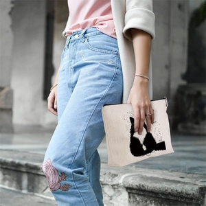 Linen pouch featuring artistic black cat silhouette and ink splash design on street