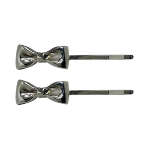 Minimalist silver metal bow hair clips for women in a two-piece set on a white background