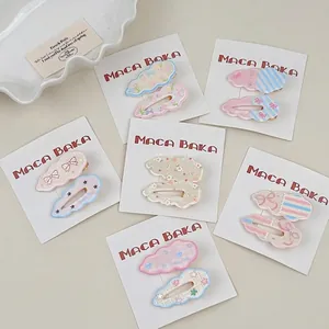 Set of 12 cute floral bow and cloud hair clips in assorted colors on display cards