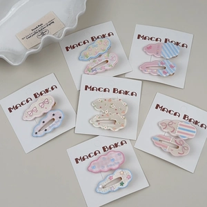Close-up of 6 pairs macaron floral cloud hair clips set on display card packaging