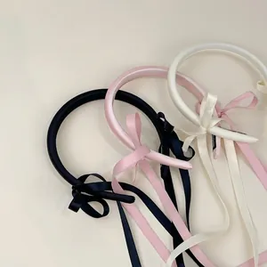Elegant satin padded headbands with long ribbon bows in black, pink and cream white