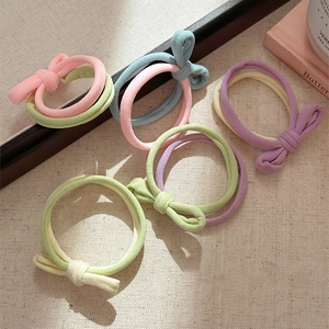 Five colorful bow hair ties for women made of durable elastic fabric in candy colors