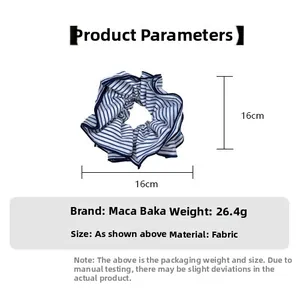 Detailed view of blue and white striped fabric scrunchie with 16cm dimension and weight info