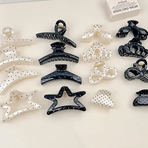 French style black and white polka dot hair claws in various elegant geometric shapes