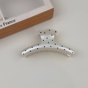 French vintage cream hair claw clip with black polka dots and high-gloss resin finish
