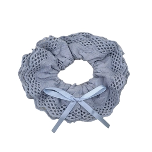 Elegant light blue lace scrunchie with satin ribbon bow for sophisticated hair styling