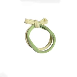 Elastic dual-strand ponytail holder with green and cream bow for stylish hair styling