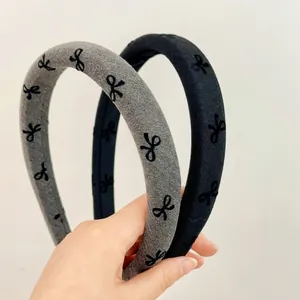Cute gray and black sponge headbands with bow print for high cranial top look