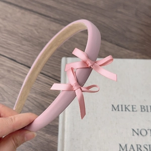 Pink satin headband with double bows in a sweet ballet style for women hair accessory