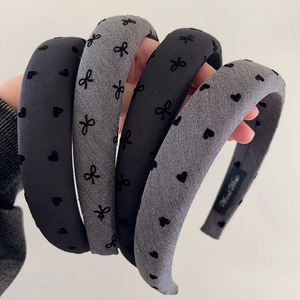 Padded polka dot and heart pattern headbands in black and grey for thick hair styling