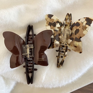 Elegant butterfly acetate hair claws in dark coffee and tortoiseshell patterns