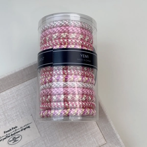 Set of 15 handmade high-elastic woven hair ties in a transparent cylindrical storage box