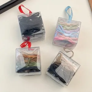 Set of four gift boxes with high elastic bow hair bands in various colorful palettes