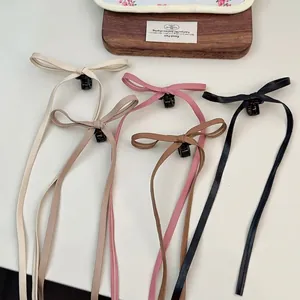 Barrettes à nœud en similicuir style ballet en cinq couleurs neutres assorties