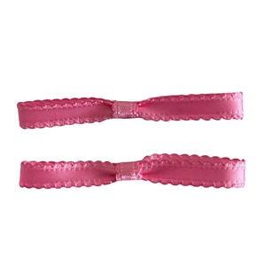 Pink ballet style satin ribbon hair clips with delicate lace edges on white background